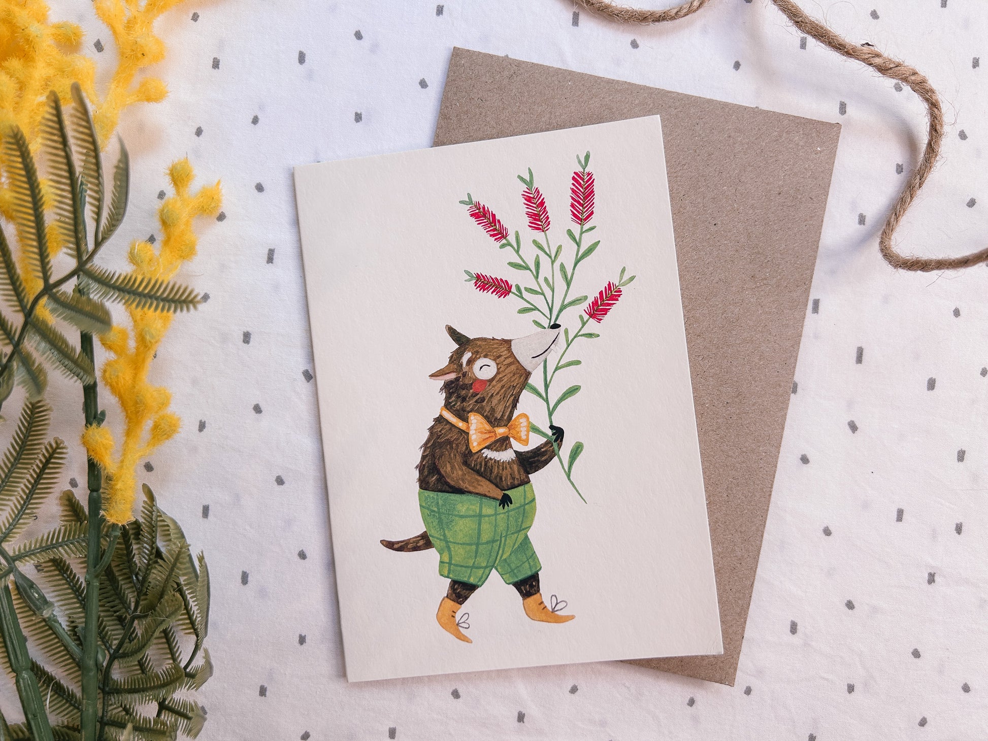 Illustrated Tasmanian devil greeting card showing a cute, happy Australian animal wearing green shorts, A6 size