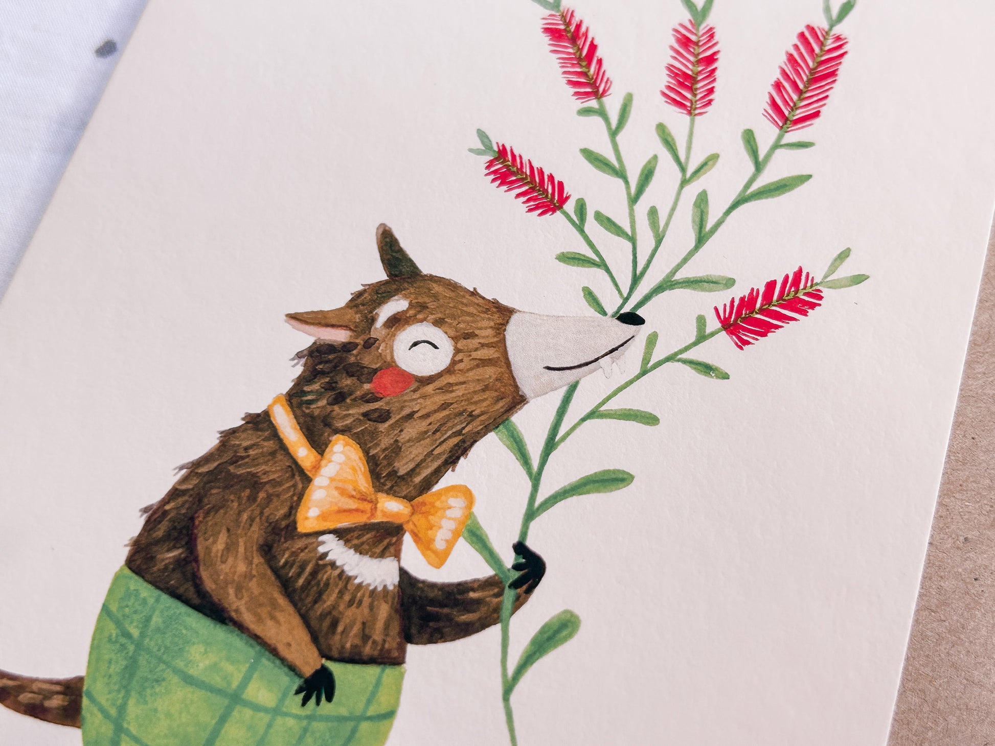 Close up of Illustrated Tasmanian devil greeting card showing a cute, happy Australian animal wearing green shorts, A6 size